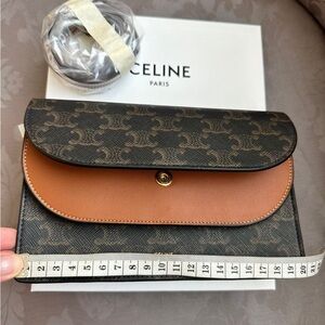 CELINE. WALLET ON STRAP IN TRIOMPHE CANVAS AND SMOOTH LAMBSKIN. Colour TAN